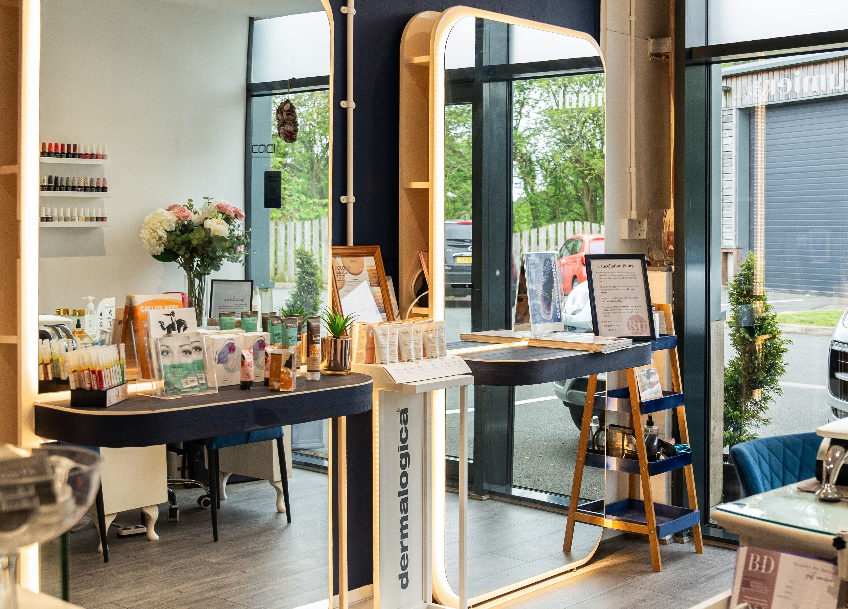 Chic reception at Be Stunning Too, Whalley, England, GB. Modern decor with beauty products displayed.