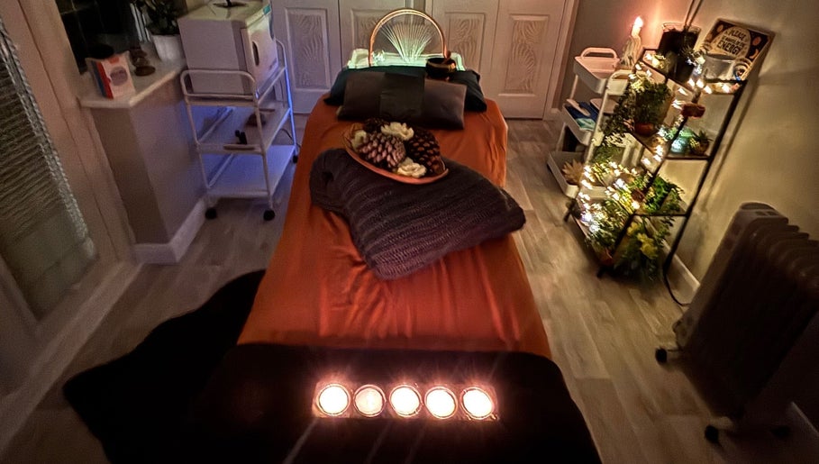 Cozy massage room at Wellness-On-Sea, Southend-on-Sea, England, GB, with ambient lighting and decor.