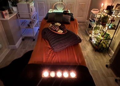 Cozy massage room at Wellness-On-Sea, Southend-on-Sea, England, GB, with ambient lighting and decor.