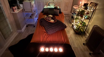 Cozy massage room at Wellness-On-Sea, Southend-on-Sea, England, GB, with ambient lighting and decor.