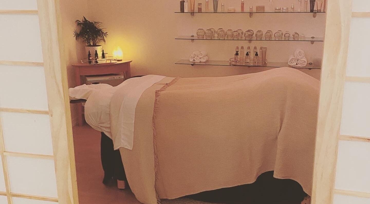 Cozy massage room at Nahara Healing Arts, Mendocino, California, US with soothing lighting and spa essentials.