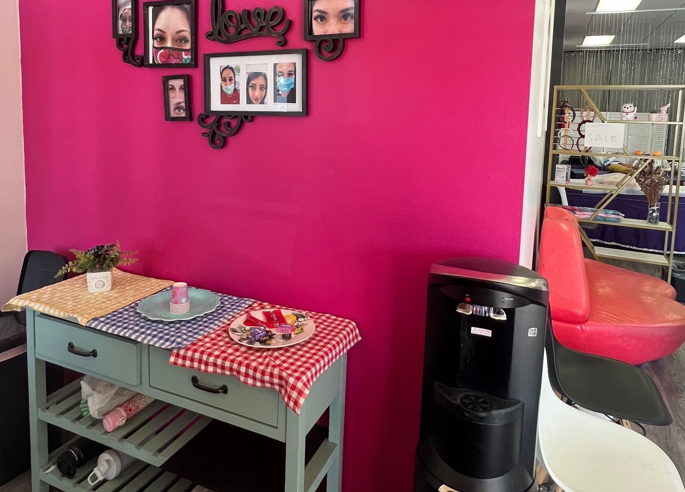 Chic interior at Super Q Lash Beauty, Upland, California, US, featuring a stylish pink wall and decor.