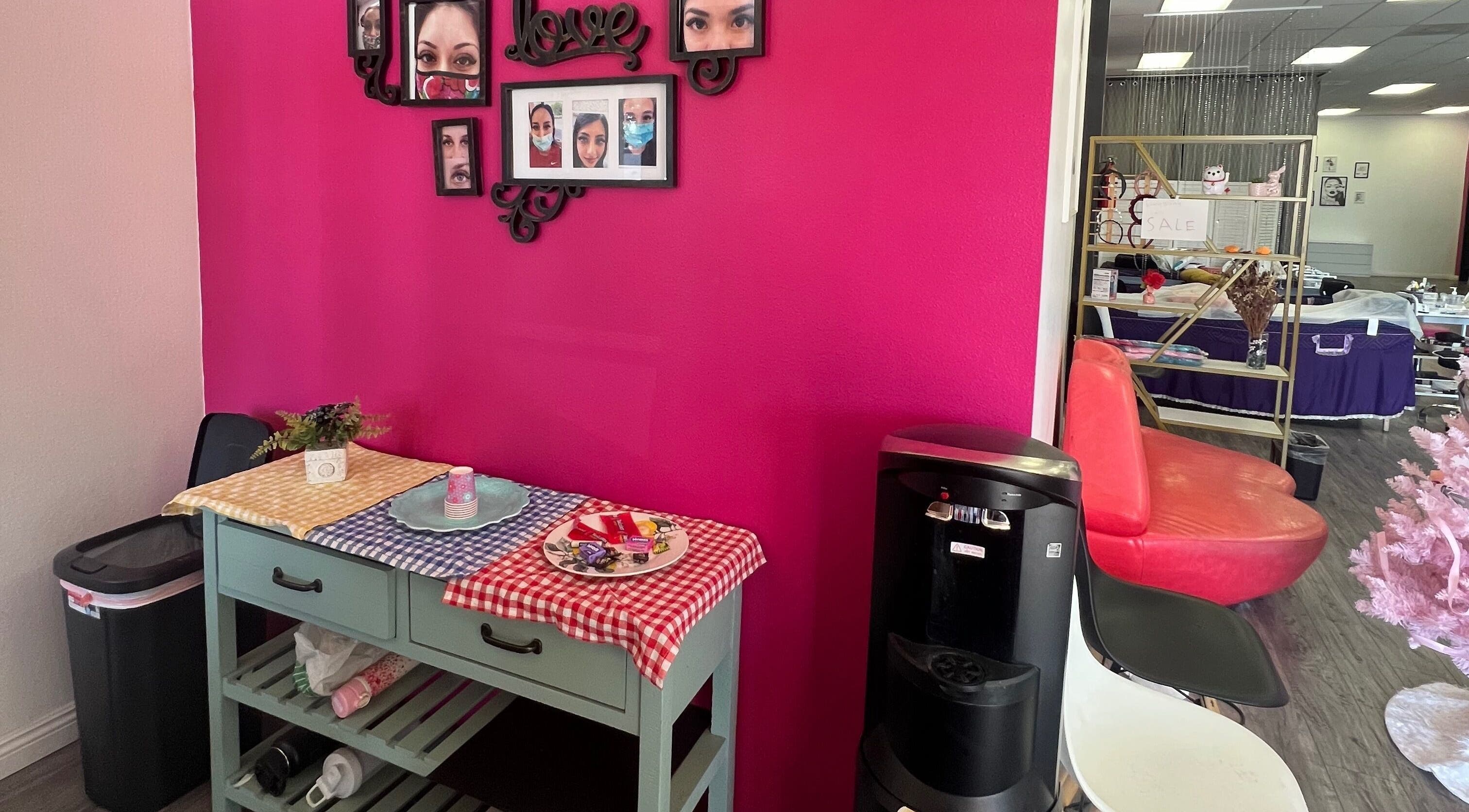 Chic interior at Super Q Lash Beauty, Upland, California, US, featuring a stylish pink wall and decor.