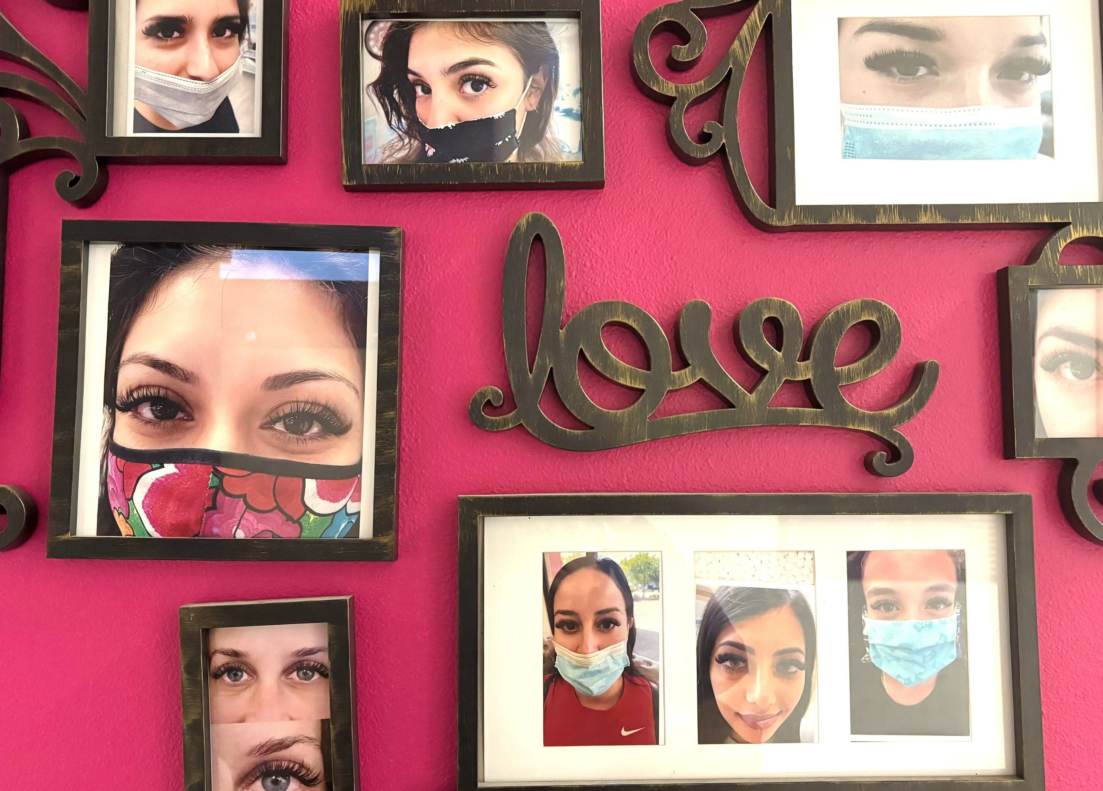 Collage of eye photos on a pink wall at Super Q Lash Beauty, Upland, California, US.