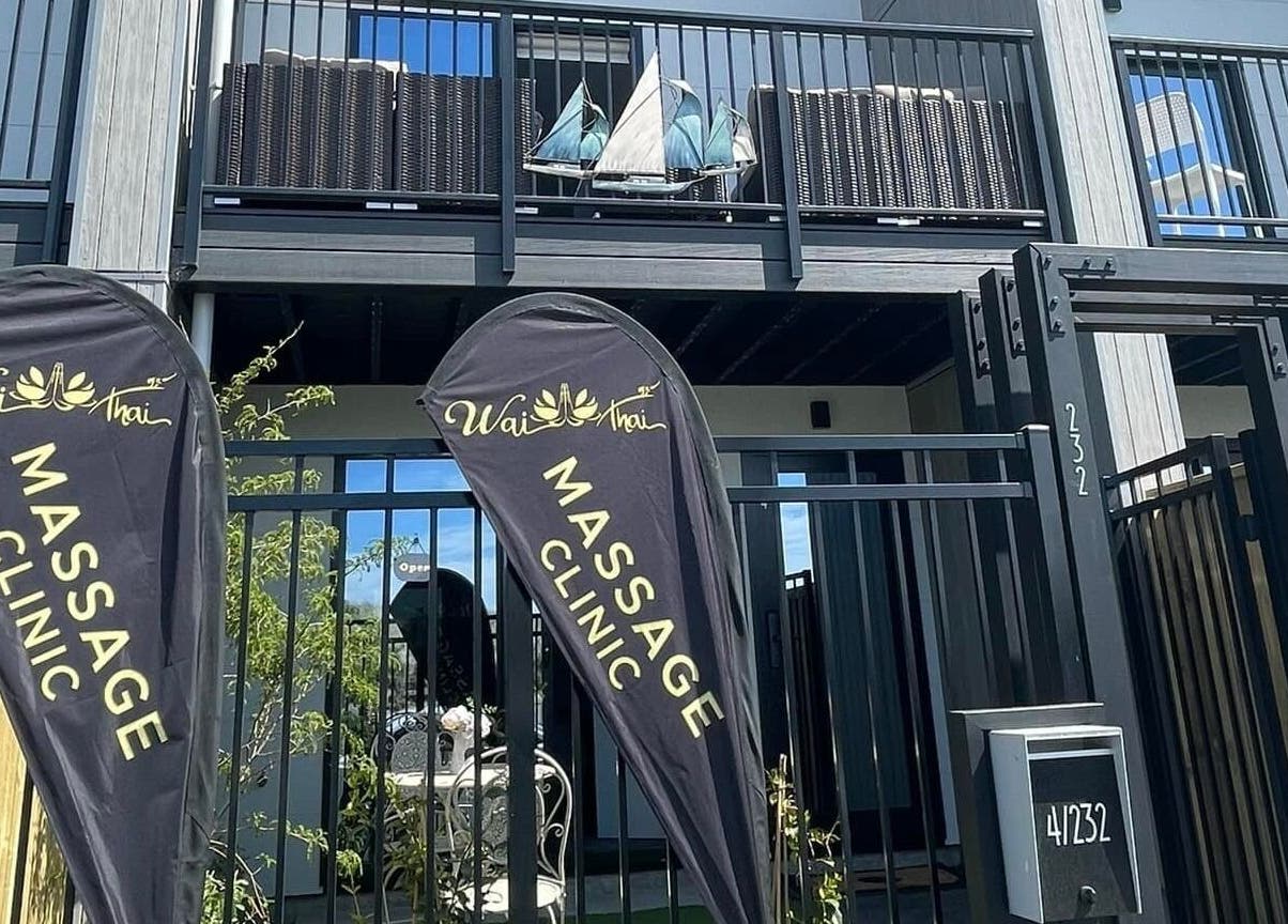 Entrance of Wai Thai Riccarton, Massage Clinic with banners in Christchurch, NZ offering a serene welcome.