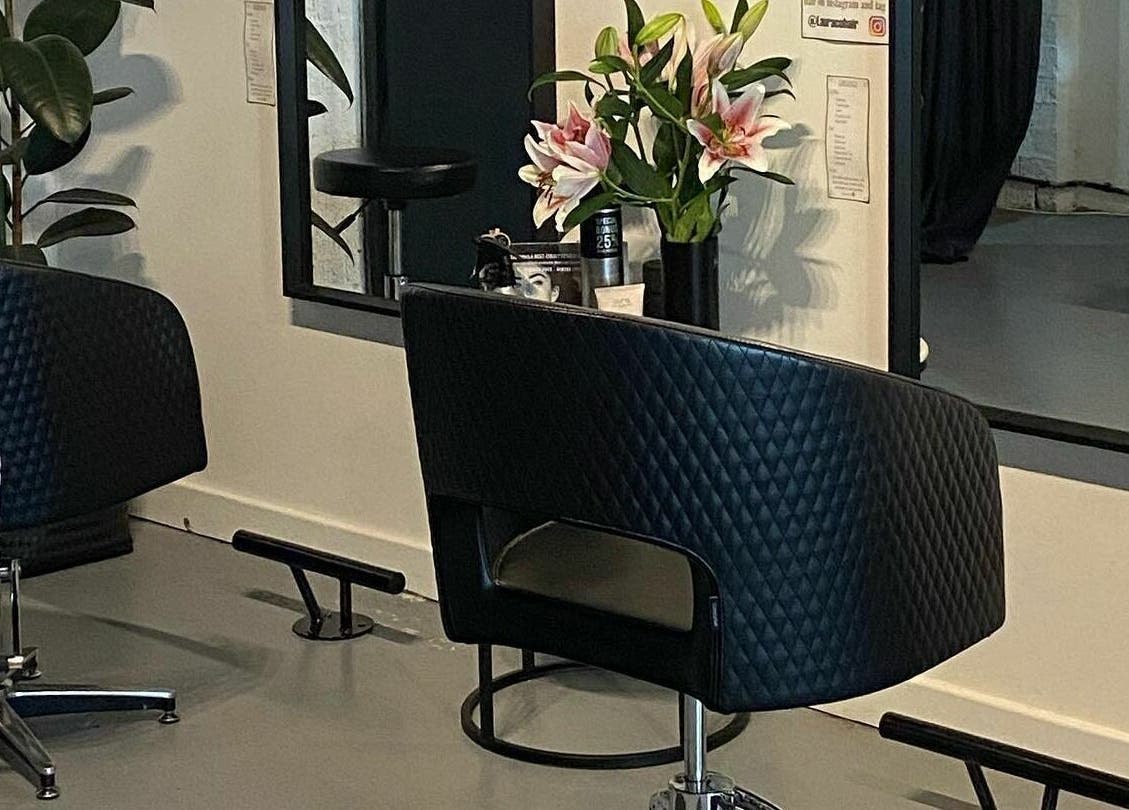 Modern styling chair at Laura and Co Hairdressing, Rozelle, New South Wales, AU with fresh flowers.