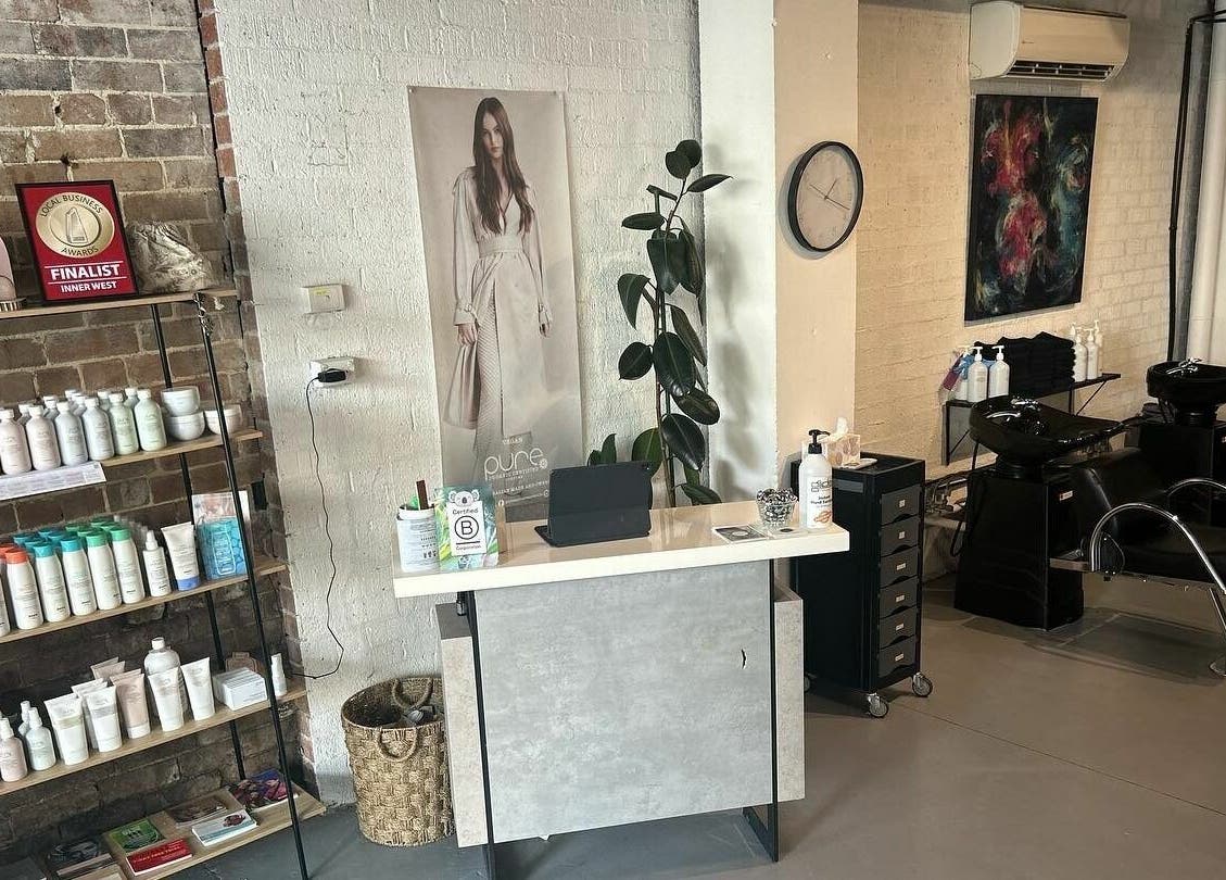 Discover the styling area of Laura and Co Hairdressing in Rozelle, New South Wales, AU with products and chairs.