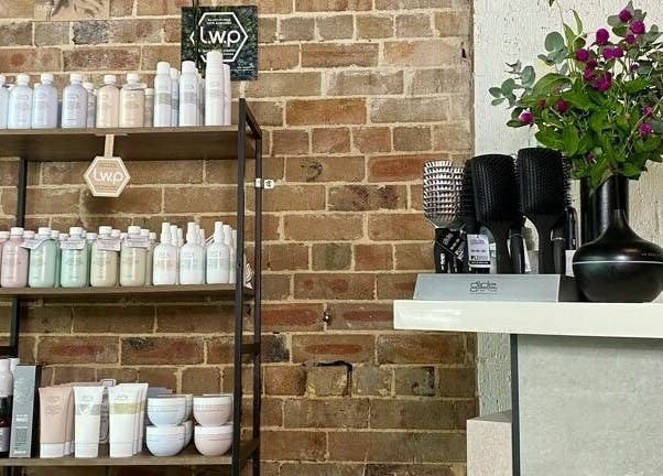 Laura and Co Hairdressing in Rozelle, New South Wales features stylish shelving with premium hair care products.