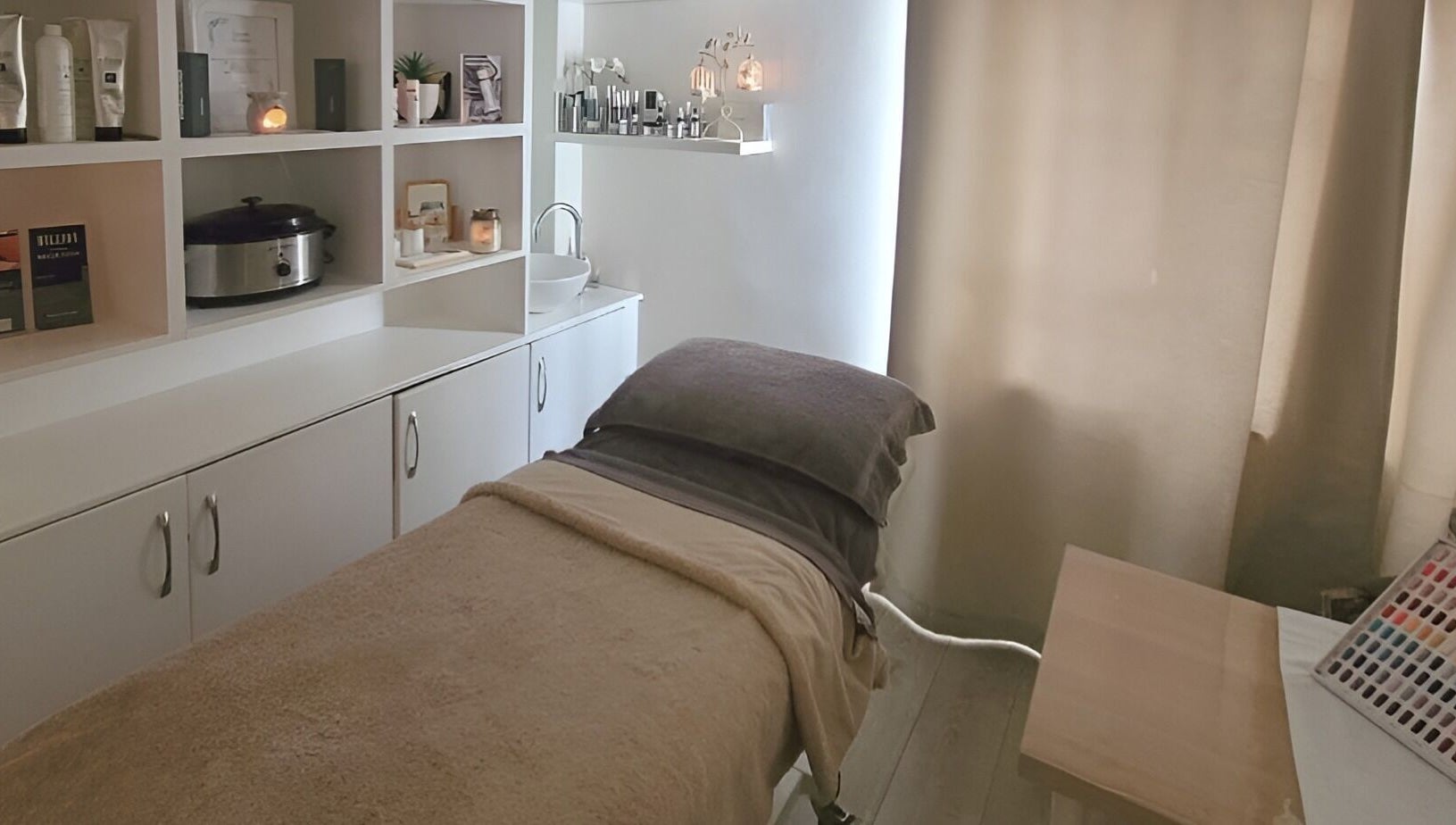 Chic therapy room in Preston, England, GB, featuring a massage bed and calming decor.