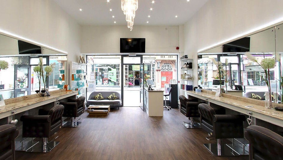 Chic interior of Design A Head Tunbridge Wells, located in Tunbridge Wells, England, GB, showcasing modern salon chairs.