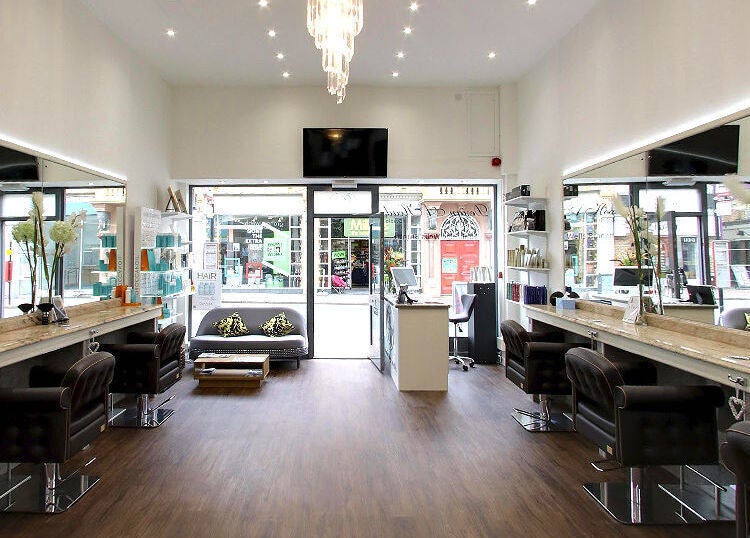 Chic interior of Design A Head Tunbridge Wells, located in Tunbridge Wells, England, GB, showcasing modern salon chairs.