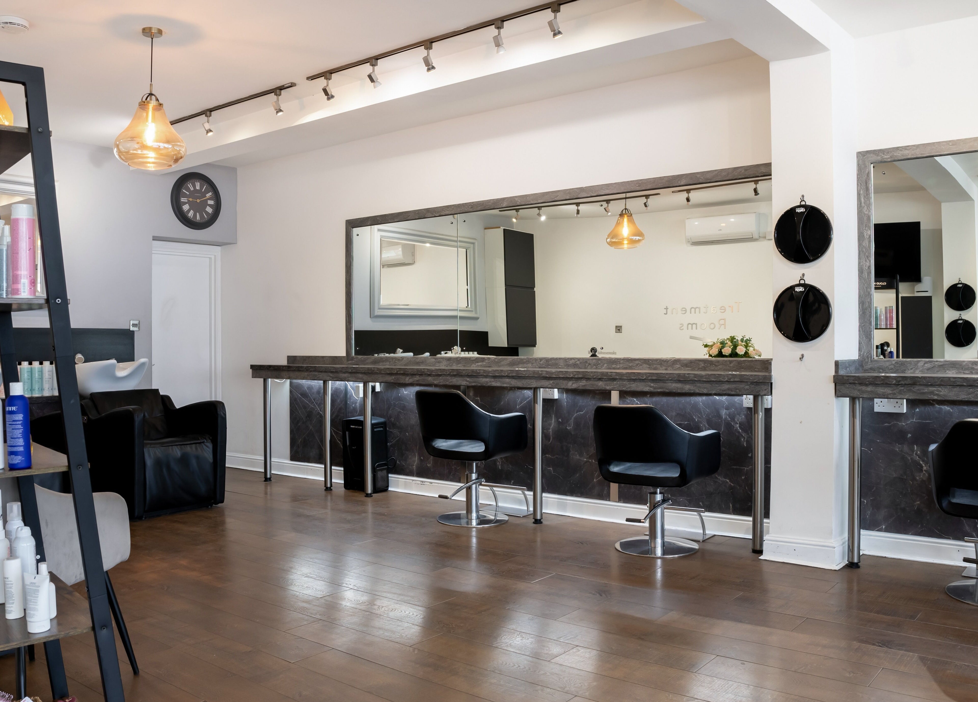 Chic interior of Design A Head Sevenoaks, a beauty venue in Sevenoaks, England, GB featuring modern styling stations.