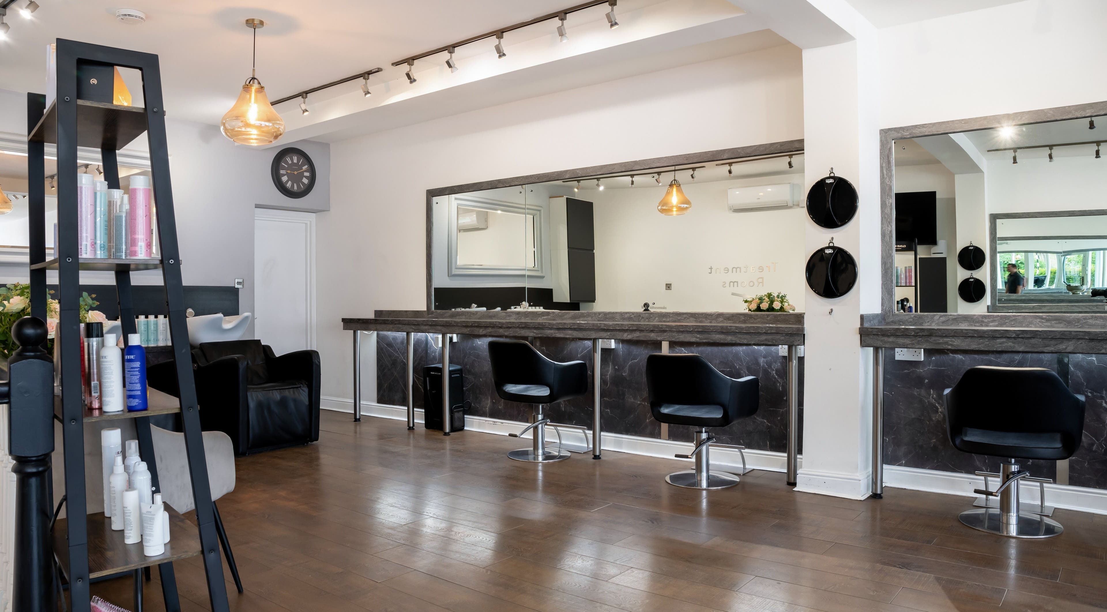 Chic interior of Design A Head Sevenoaks, a beauty venue in Sevenoaks, England, GB featuring modern styling stations.