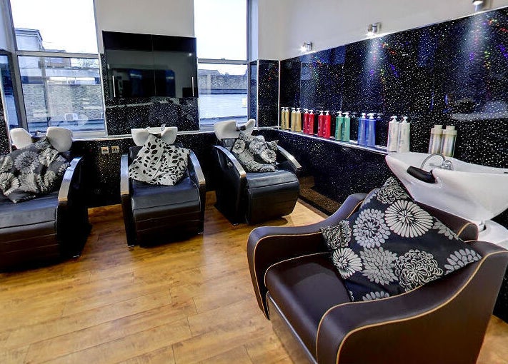 Stylish wash stations at Design A Head Tonbridge, featuring modern black decor in Tonbridge, England, GB.