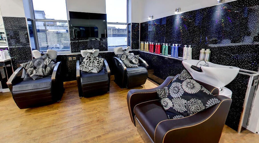 Stylish wash stations at Design A Head Tonbridge, featuring modern black decor in Tonbridge, England, GB.