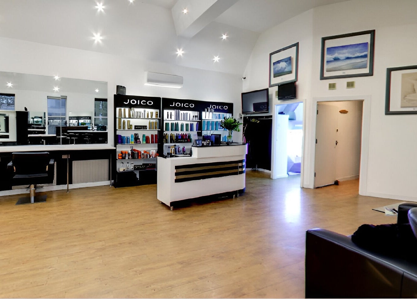 Modern salon interior at Design A Head Tonbridge, Tonbridge, England, GB featuring sleek styling stations.