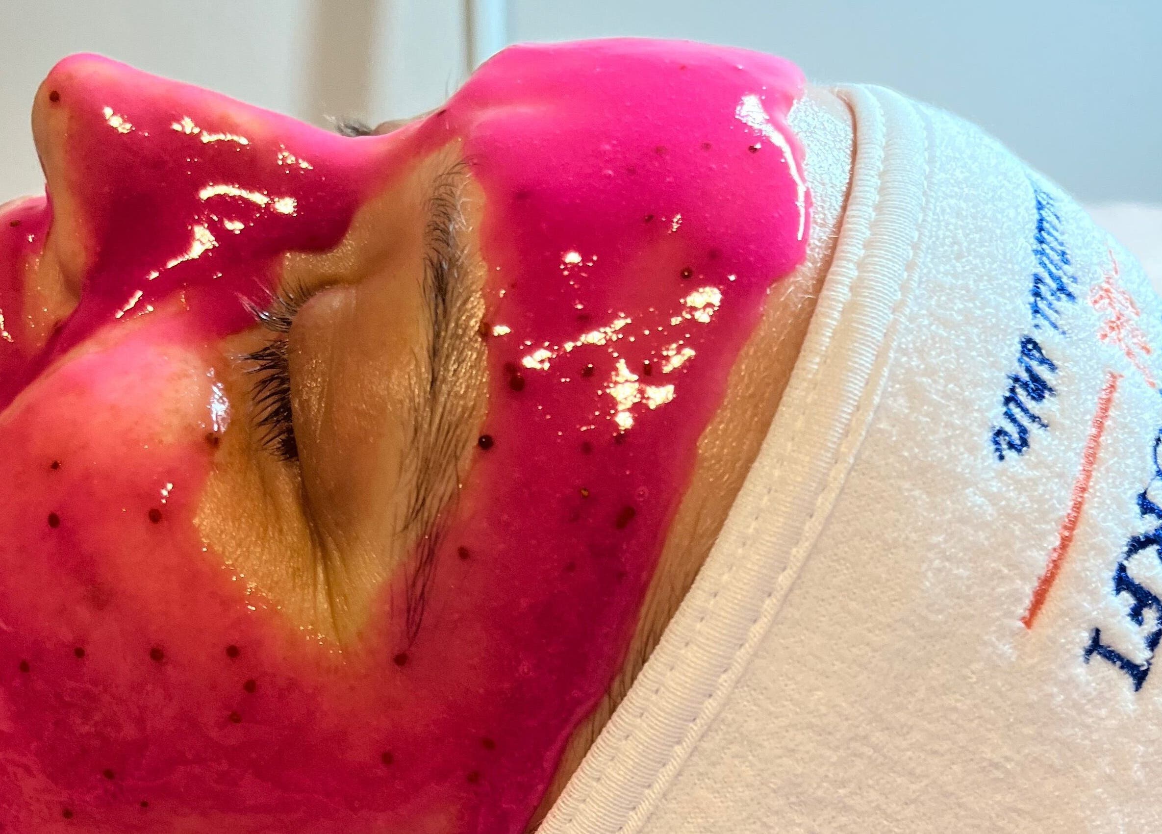 Vibrant pink facial mask at The Glam Bar, Campbelltown, New South Wales, AU enhancing skincare experience.
