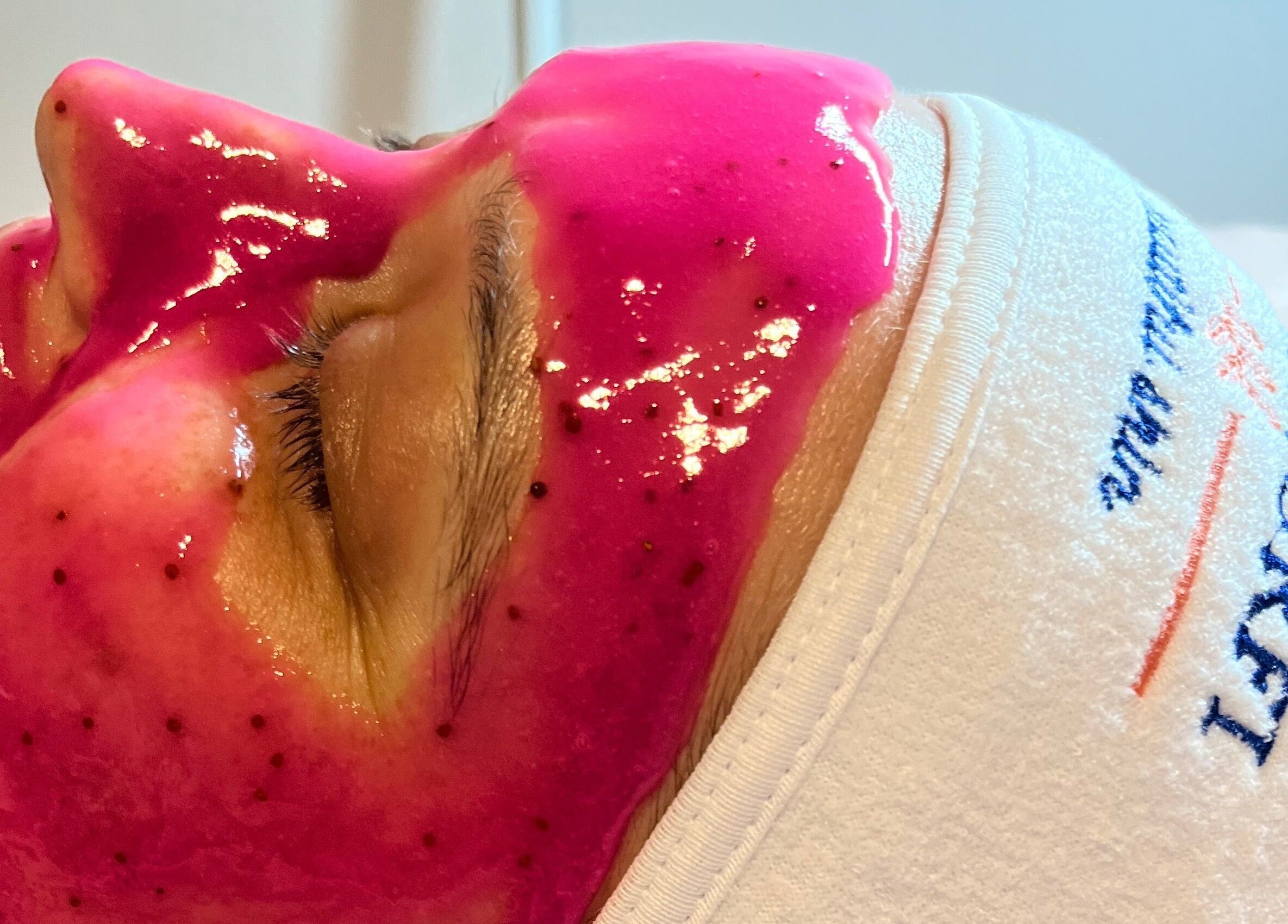Vibrant pink facial mask at The Glam Bar, Campbelltown, New South Wales, AU enhancing skincare experience.