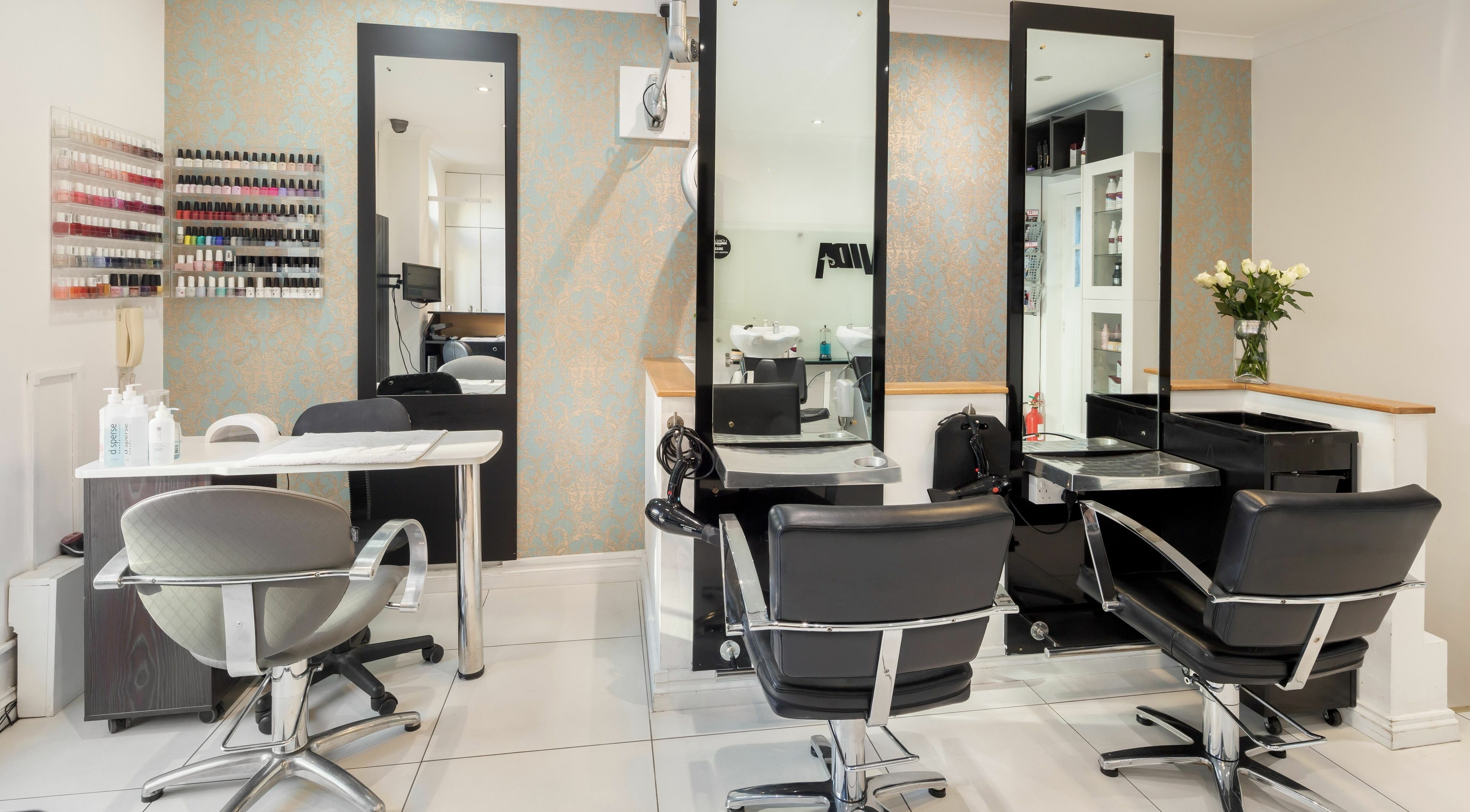 Sophisticated styling chairs at Vida Hair and Beauty, London, England, GB, showcasing elegant salon setup.