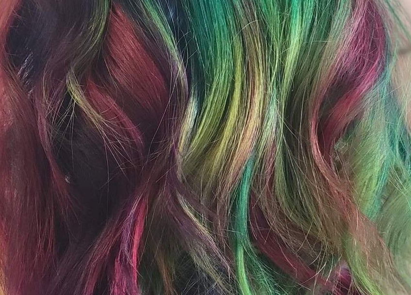 Colorful hair dye at Roxstar Hair Design, Punta Gorda, Florida, US, showcasing vibrant styling creativity.