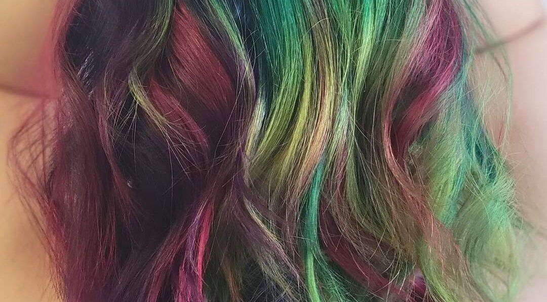 Colorful hair dye at Roxstar Hair Design, Punta Gorda, Florida, US, showcasing vibrant styling creativity.