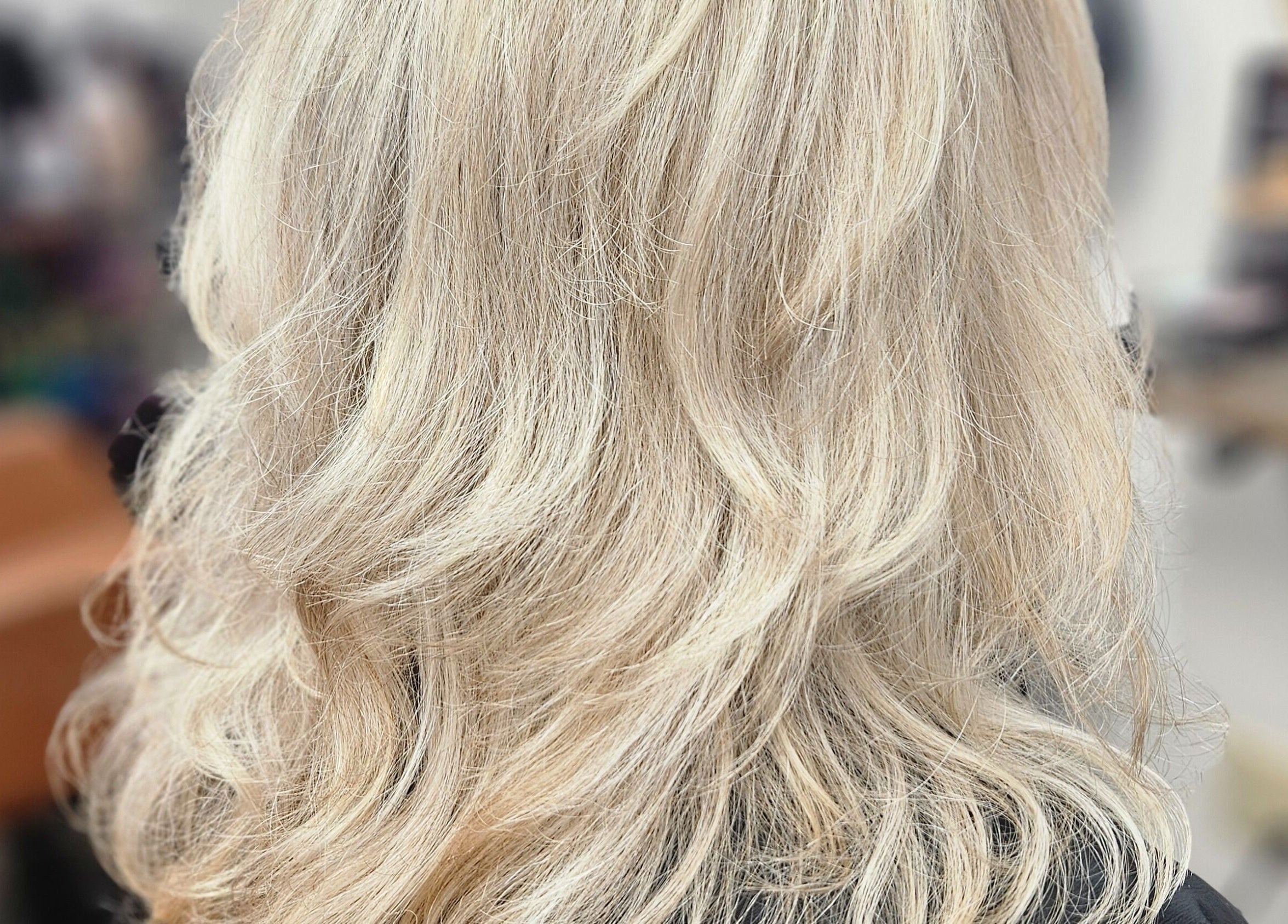 Blonde wavy hairstyle showcase at Roxstar Hair Design, Punta Gorda, Florida, US.