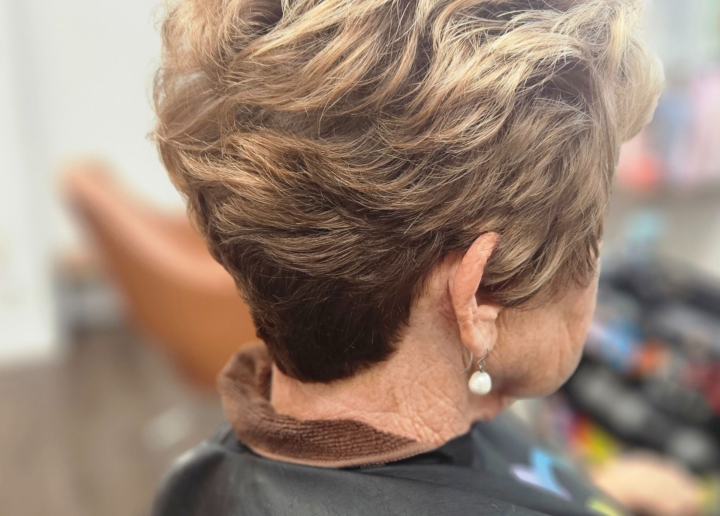 Stylish pixie cut at Roxstar Hair Design in Punta Gorda, Florida, US, showcasing expert layering and texture.