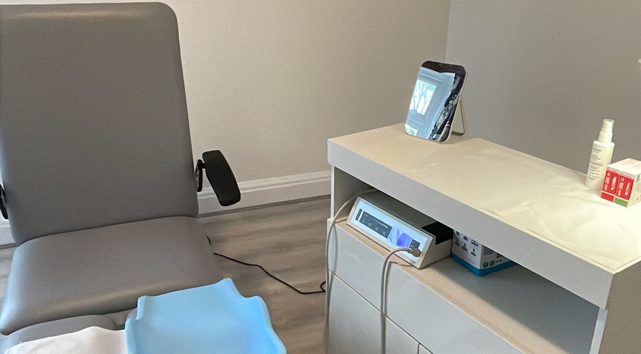 Clean treatment area at MY FOOT CLINIC Winton, Bournemouth, GB featuring a chair and equipment.