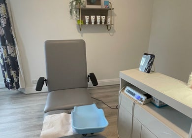 Modern treatment room at MY FOOT CLINIC Winton, Bournemouth, GB, featuring comfortable chair and equipment.