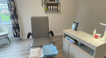 Modern treatment room at MY FOOT CLINIC Winton, Bournemouth, GB, featuring comfortable chair and equipment.