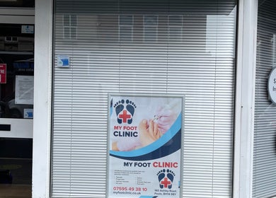 Entrance of MY FOOT CLINIC (Parkstone) in Poole, England, GB with open sign and clinic poster displayed.