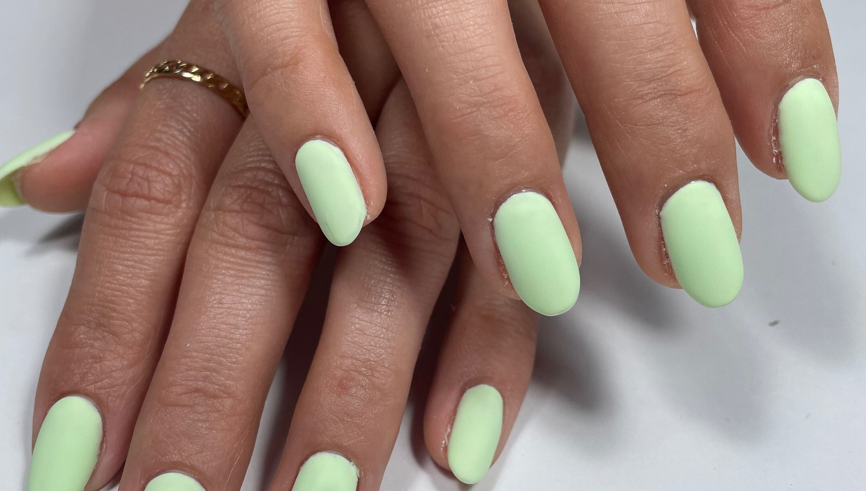 Bright mint green nails at Beau Nails, San Ġwann, MT, showcasing chic elegance and professional manicure.