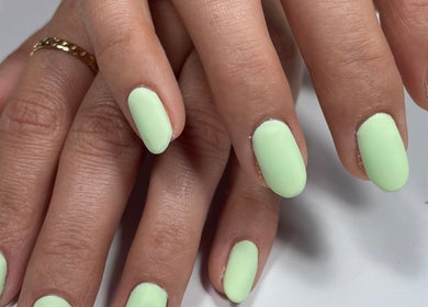 Bright mint green nails at Beau Nails, San Ġwann, MT, showcasing chic elegance and professional manicure.