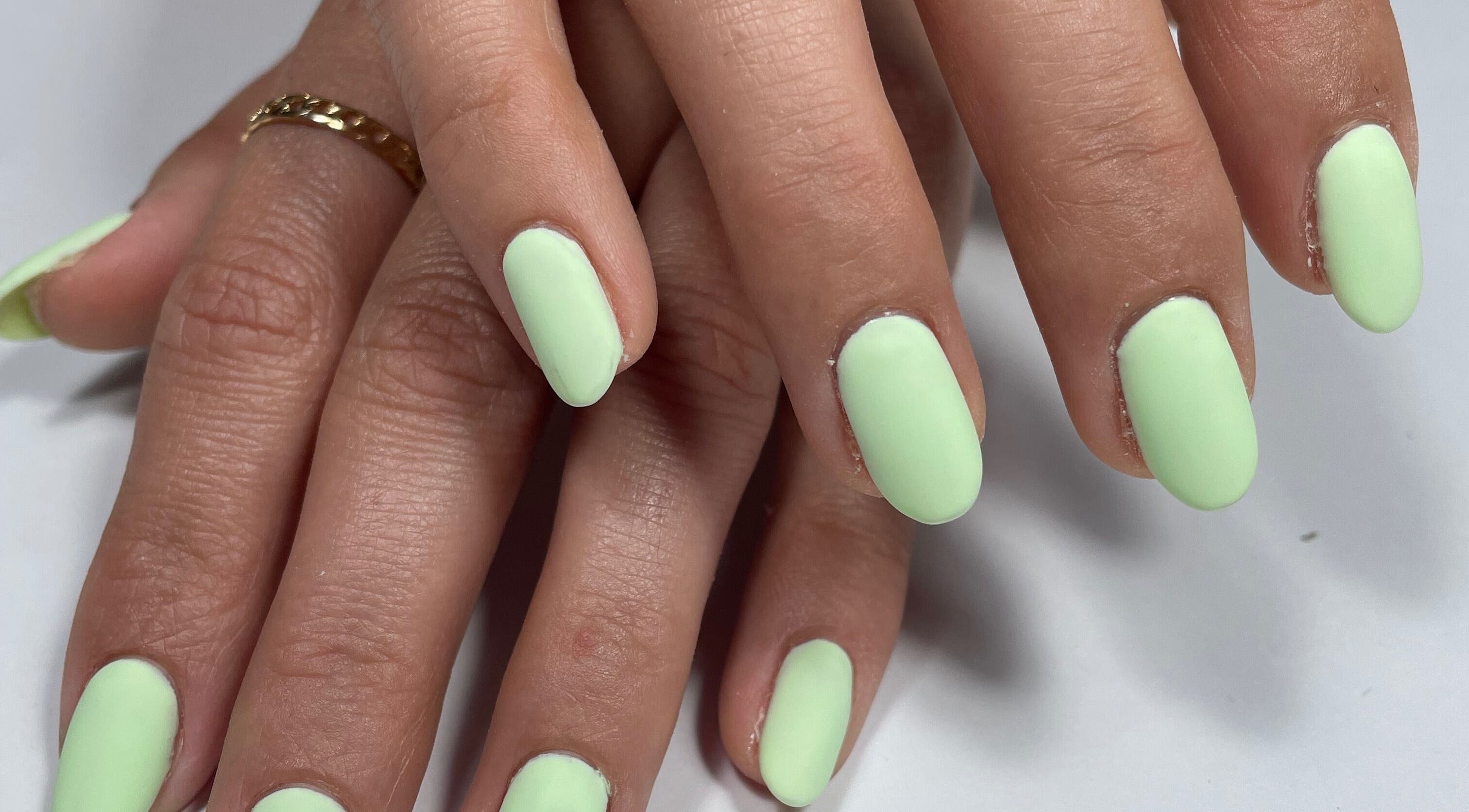 Bright mint green nails at Beau Nails, San Ġwann, MT, showcasing chic elegance and professional manicure.