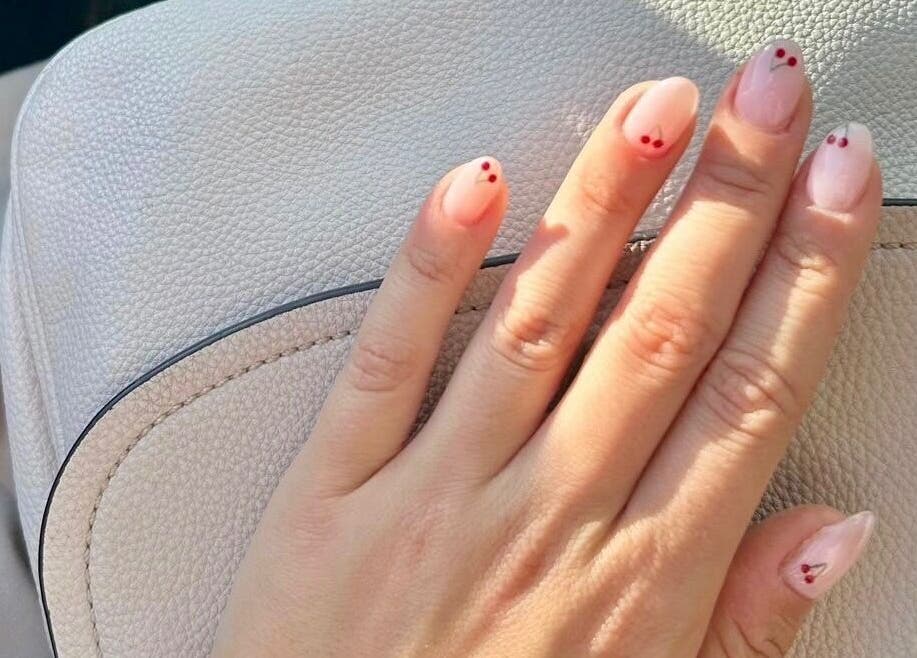 Elegant cherry nail art at Beau Nails in San Ġwann, MT, showcasing delicate designs for a stylish look.