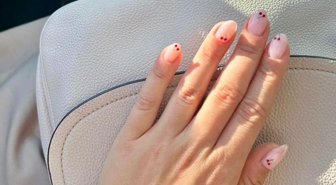 Elegant cherry nail art at Beau Nails in San Ġwann, MT, showcasing delicate designs for a stylish look.
