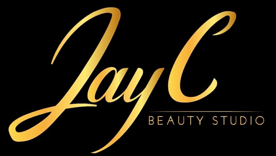 Elegant gold script logo of JayC Beauty Studio, Bridgetown, Christ Church, BB on a sleek black background.