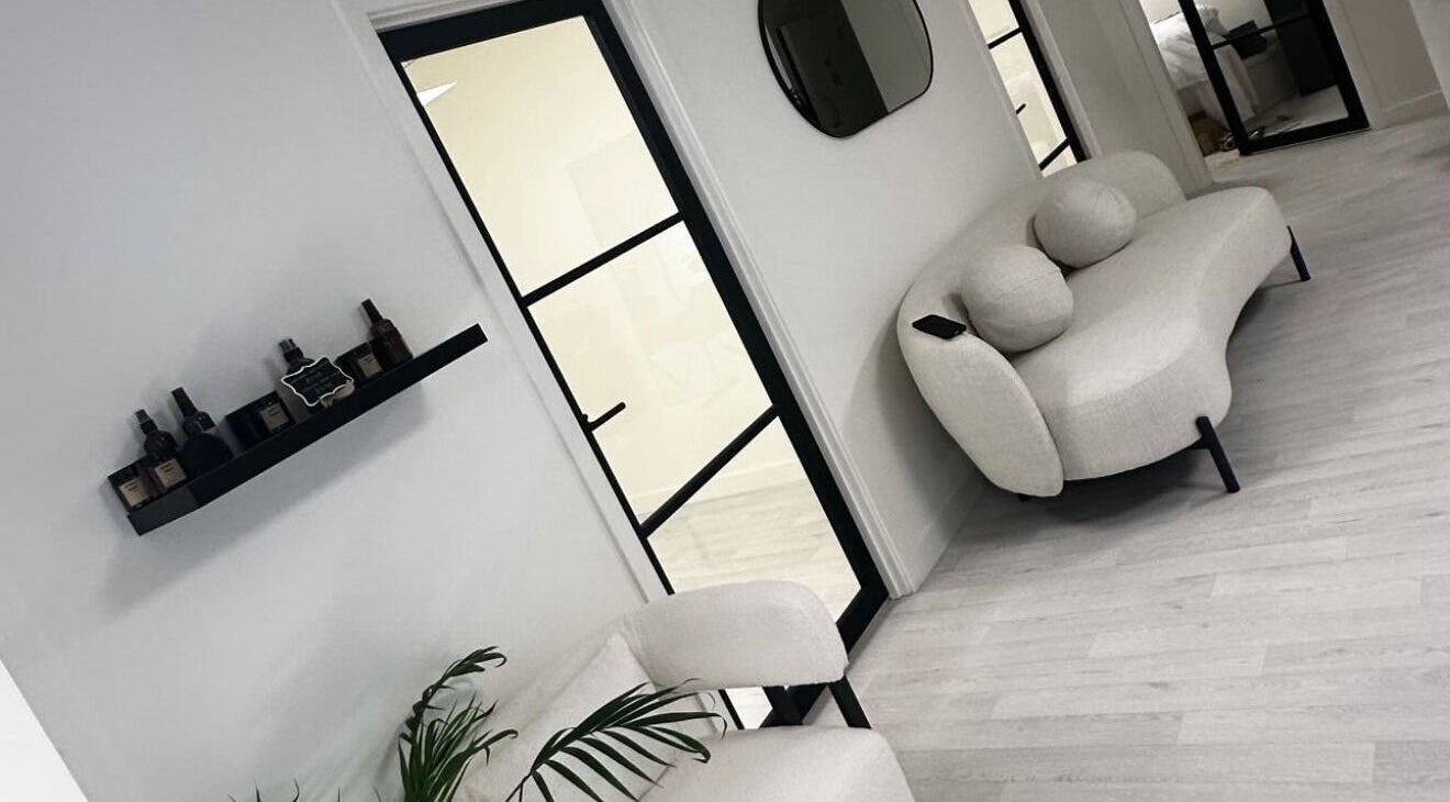 Chic seating area at Thesachhouse, Wigan, England, GB, with beige sofa and sleek decor.