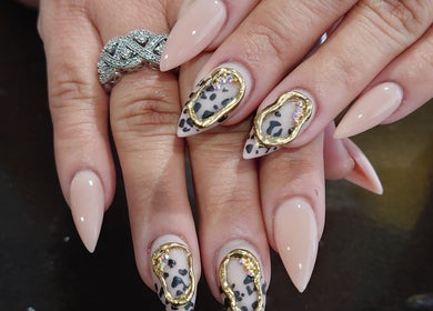 Stylish nail art with gold accents at Celeste's Nail Studio, Fairfax, Virginia, US.