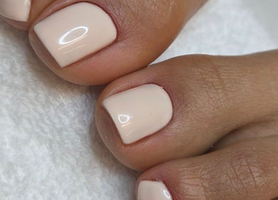 Freshly polished toes at Celeste's Nail Studio in Fairfax, Virginia, US. Soft nude shade on well-manicured nails.