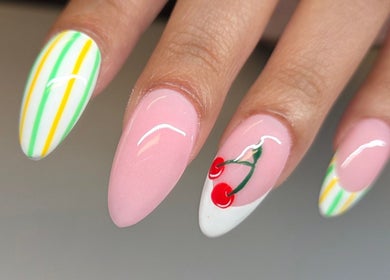 Colorful stripe and cherry nail art at Celeste's Nail Studio in Fairfax, Virginia, US.