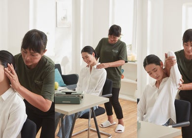 Therapist at Please Massage in Bangkok, Bangkok, TH giving a calming massage in a serene setting.