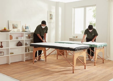 Massage therapists preparing tables in Please Massage, Bangkok, Bangkok, TH.