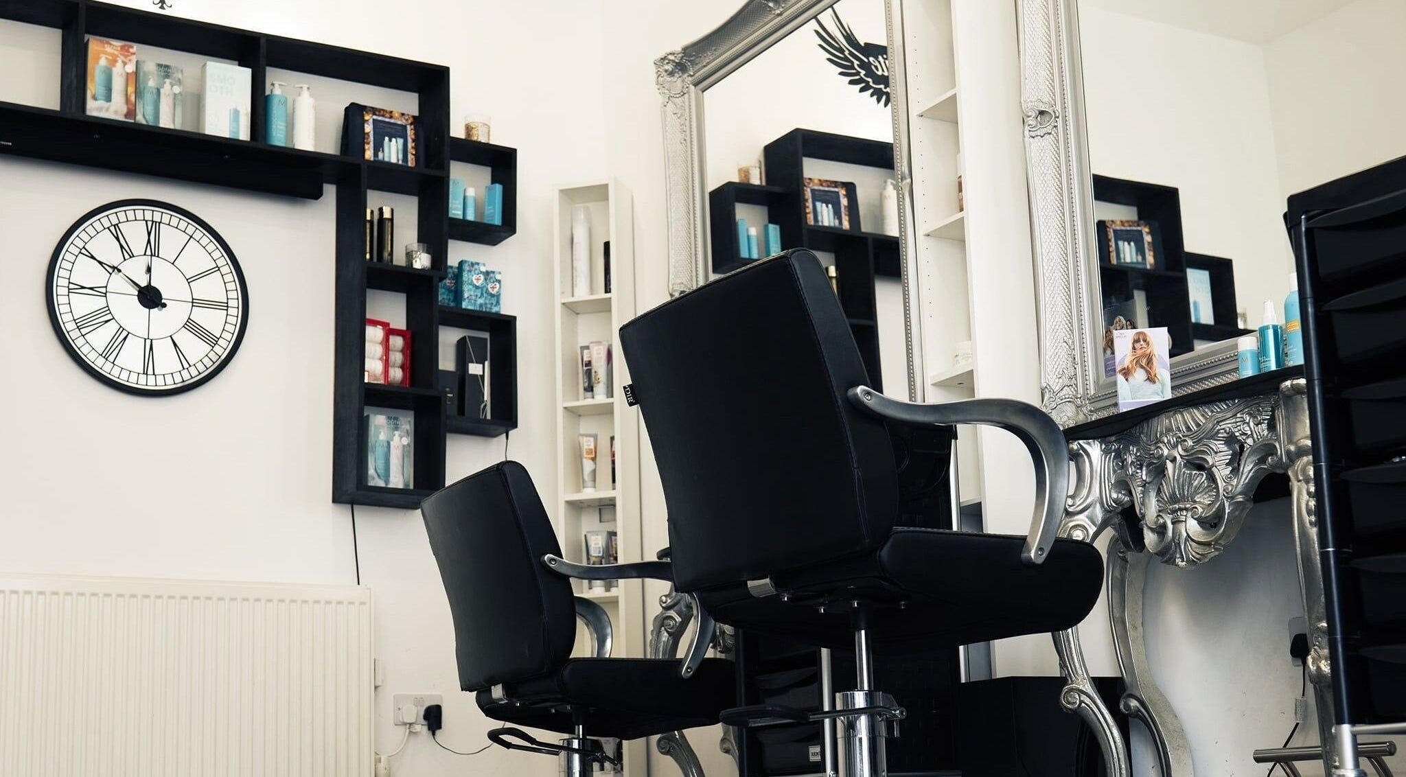 Elegant salon chairs and mirrors at Angel White Hair and Beauty in Littlehampton, England, GB.