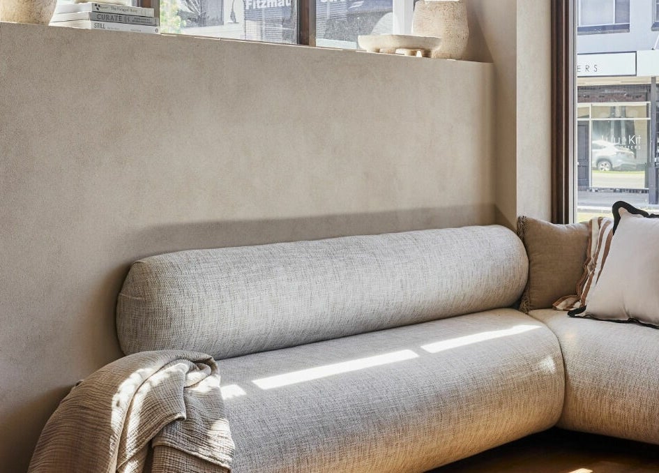 Relaxing seating area with plush couch at Bennett and Barkell in Wagga Wagga, New South Wales, AU.