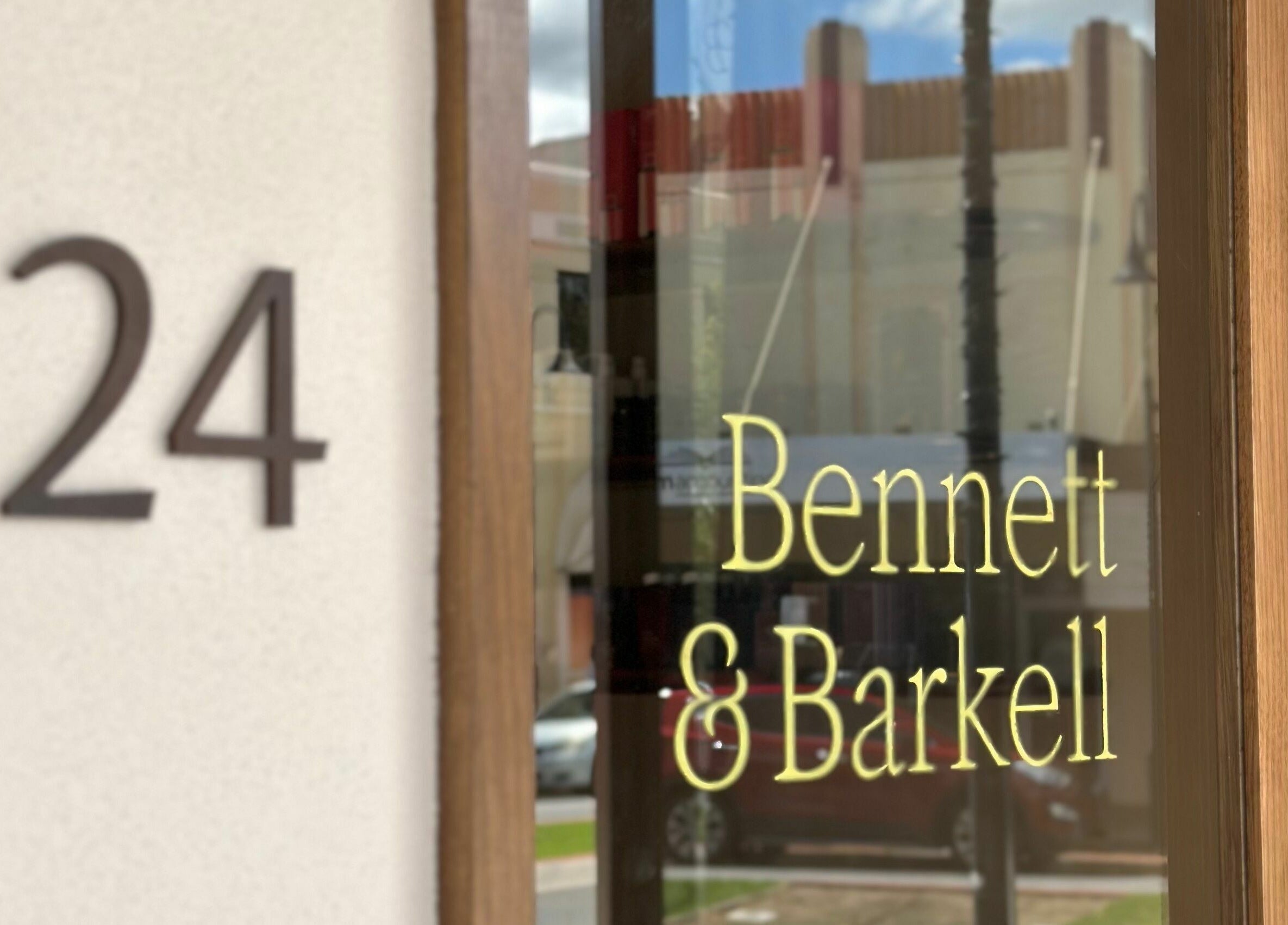 Front sign of Bennett and Barkell at 24, Wagga Wagga, New South Wales, AU, reflecting urban elegance.