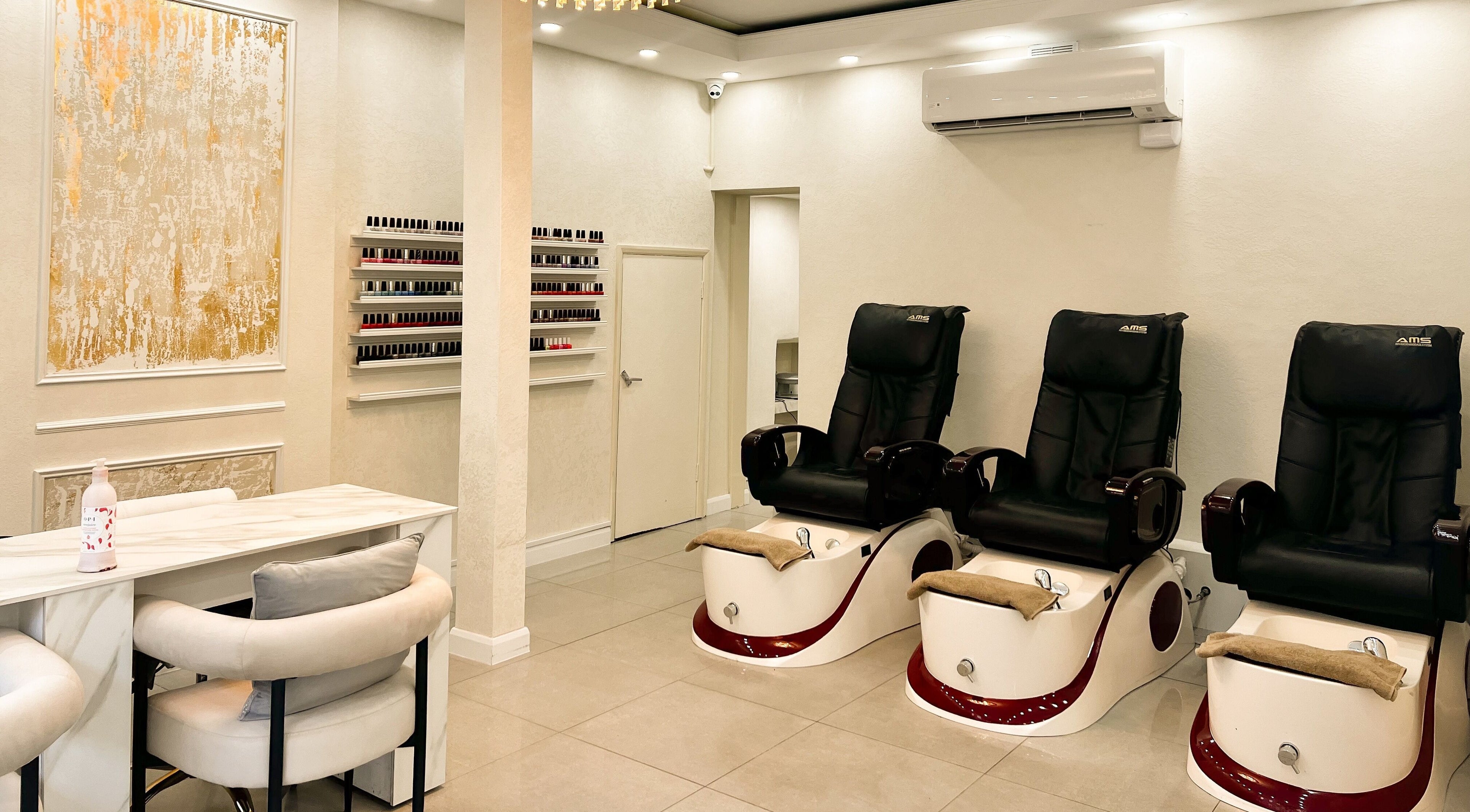 Luxurious nail salon interior at Nails and Co. London, featuring plush pedicure chairs in London, England, GB.