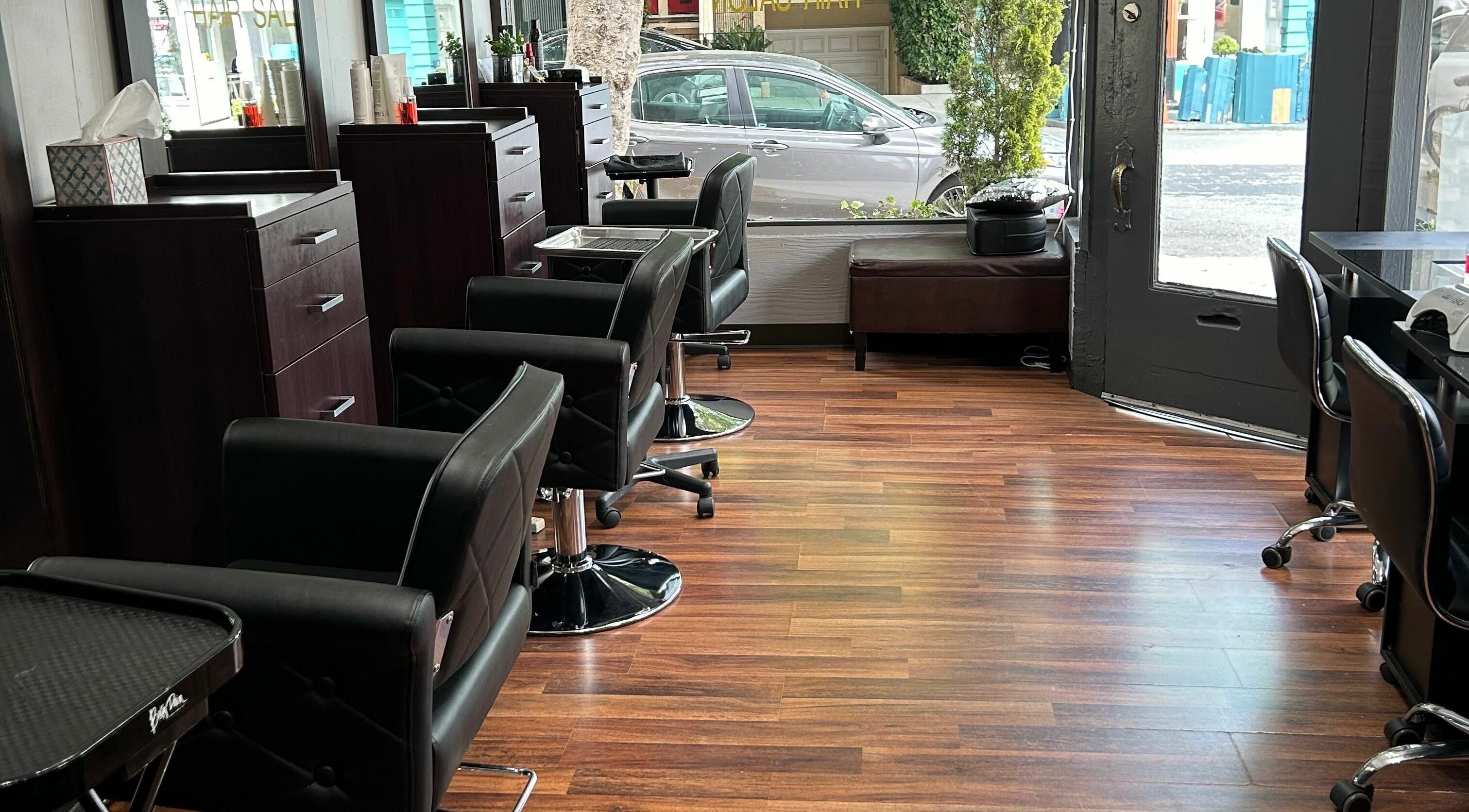 Chic interior of Fekaso Hair Salon in San Francisco, California, US with modern styling chairs and sleek decor.