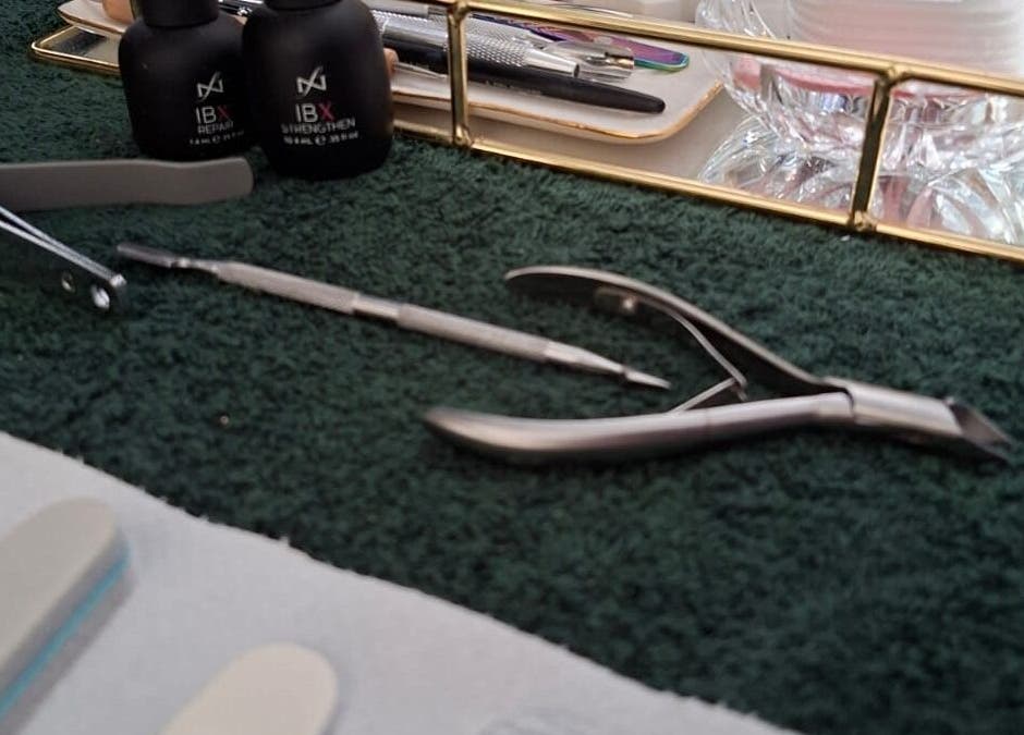 Nail care tools at Paisley Studio, Cape Town, Western Cape, ZA, showcasing nail clippers and buffers.