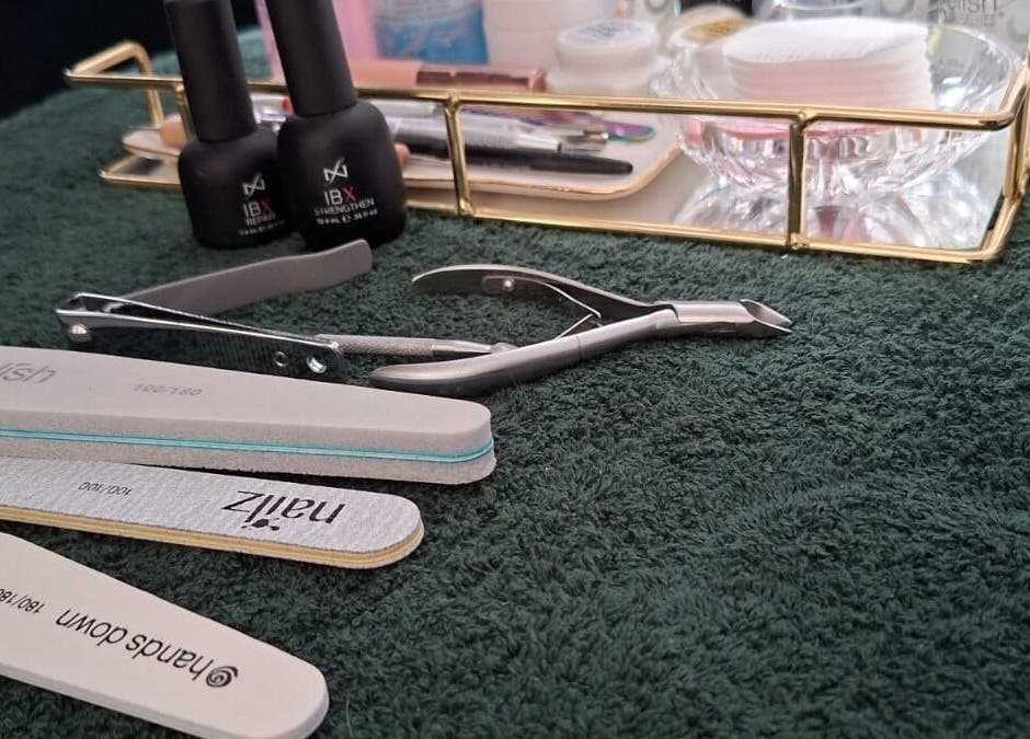 Nail care tools at Paisley Studio, Cape Town, Western Cape, ZA, arranged on a plush towel.